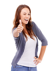 Image showing Thumbs up, portrait and woman wink in studio for winning achievement, celebrate deal and vote on white background. Happy model, emoji sign and yes for feedback, promotion and thank you for excellence