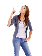 Image showing Pointing, looking and young woman in a studio with mockup for marketing, promotion or advertising. View, mock up and female person from Canada with show hand gesture isolated by white background.