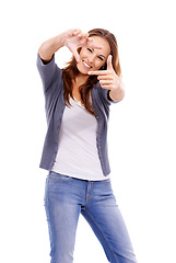 Image showing Portrait, happy woman and finger frame in studio to review profile picture, check creative composition and border on white background. Model planning perspective for photography of perfect selfie
