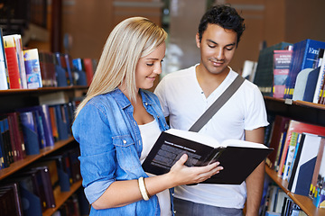 Image showing Teamwork, book or students reading in a library at university, college or school campus for education. Bookshelf, learning or young people with scholarship studying knowledge, research or information