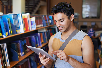 Image showing Research, tablet or happy man in library at university, college or school campus for education. Bookshelf, elearning or male student with scholarship studying knowledge, online course or information