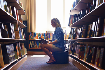 Image showing Reading book, girl or student in library at university, college or school campus for education growth. Bookshelf, learning or smart woman with scholarship studying knowledge, research or information