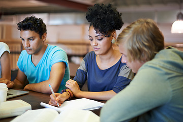 Image showing Group, education and students writing in notes studying for exam or learning information in classroom. University, college or diverse learners with teamwork for knowledge, academic course or research