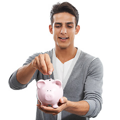 Image showing Man, piggy bank and coins of money in studio for investment, budget and finance on white background. Model, savings and investing cash in container for safety, financial freedom and growth of wealth