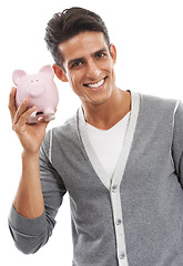 Image showing Portrait, man and piggy bank in studio for investment, finance or investing income on white background. Happy model, financial savings or moneybox for growth, cash funding or economy of future wealth