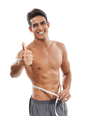 Image showing Happy man, portrait and thumbs up for success with tape measure in fitness or diet against a white studio background. Handsome or muscular male person with like emoji or yes sign for workout exercise