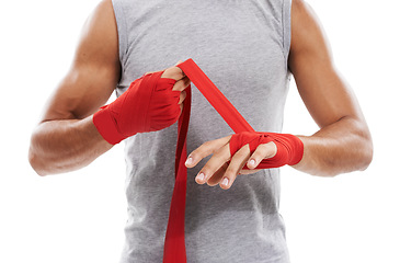 Image showing Hands, wrapping with red cloth and boxing, fitness and person training in martial arts isolated on white background. Closeup of fighter strapping wrist, protection or safety with MMA in a studio