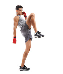 Image showing Man, kick boxing training and studio for fitness, health and wellness with balance by white background. Person, athlete and martial arts with foot, thinking and exercise for mma, fight and conflict