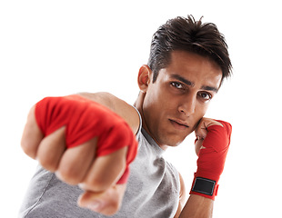 Image showing Man, hand and punch in kickboxing and sports for fitness, health and martial arts on white background. Strong athlete in portrait, action and ready with fist, MMA training and exercise in studio