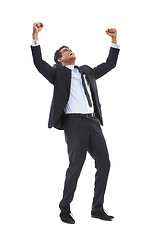 Image showing Business man, fist celebration and studio with smile for profit, revenue and bonus by white background. Entrepreneur, trader or winner person with goals, achievement and happy with yes for results