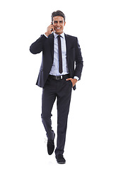 Image showing Business man, phone call and portrait in studio for communication, consulting and contact on white background. Happy corporate worker walking with mobile for conversation of advice, feedback and news