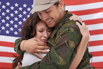 Image showing American couple hug, reunion after war and people with love and welcome hero back with flag. Soldier in army, reunite with partner after military service and man in uniform is happy with woman