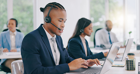 Image showing Business people, telemarketing and call center with laptop, black man and customer service. Staff, group or professional with headphones, typing and internet with advice, tech support and help desk