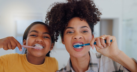 Image showing Portrait, bathroom and mother brushing teeth with child for oral health and wellness at home. Bonding, hygiene and young mom and girl kid with morning dental care routine together at house in Mexico.
