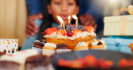 Image showing Happy birthday, cake and candle light in celebration with family for party, holiday or special day at home. Closeup of little girl blowing flame for wish in growth, love or care and bonding at house