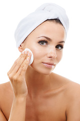 Image showing Skincare, portrait or woman in studio with cotton pad on face, cosmetics or makeup cleaning product. Dermatology, remove or wellness for model with beauty, toner or facial glow on white background