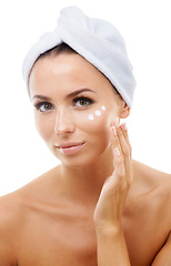Image showing Portrait of woman, white background or face cream for skincare, beauty or cosmetics in studio. Apply, towel or female model with product, wellness or glow for lotion, dermatology or facial treatment