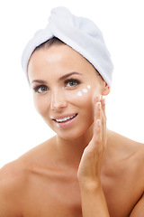 Image showing Portrait of model, white background or face cream for skincare, beauty or cosmetics in studio. Apply, towel or female person with product, wellness or glow for lotion, dermatology or facial treatment
