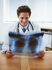 Image showing Man doctor in office, check xray and health, medical diagnosis and review of lung scan at cardiology clinic. Radiology, assessment of results and human anatomy with happy surgeon, MRI and skeleton