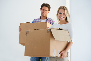 Image showing Happy, boxes and portrait of couple in new home living room for unpacking and moving together. Smile, love and young man and woman from Australia with cardboard packages in home or apartment.