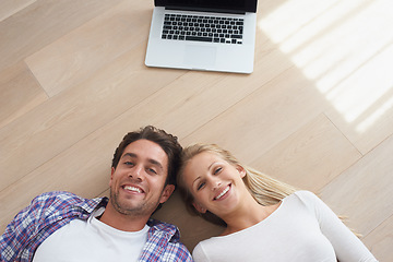 Image showing Happy couple, portrait and living room floor with laptop, marriage and relax for love, home and tech. Wife, husband and smile for commitment, bonding together and care for relationship, man or woman