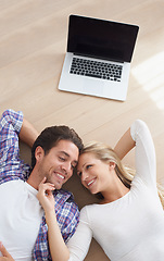 Image showing Happy couple, touch and living room floor with laptop, marriage and relax for love, home and tech. Wife, husband and smile for commitment, bonding together and care for relationship, man or woman