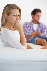 Image showing Couple, angry and living room couch with anger, upset and thinking with disagreement fight or mad. Divorce, betrayal and relationship with cheating, stress and argument for marriage, man and woman