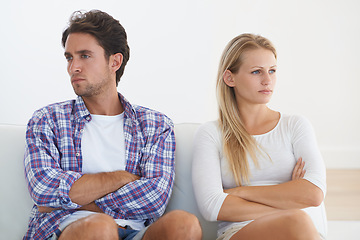 Image showing Couple, angry and living room couch with disagreement, upset and thinking with anger, fight or mad. Divorce, betrayal and relationship with cheating, stress and argument for marriage, home or toxic