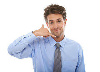 Image showing Portrait, hand phone and call me with businessman in studio isolated on white background for communication. Face, consulting and networking with happy young employee at work for contact or advice