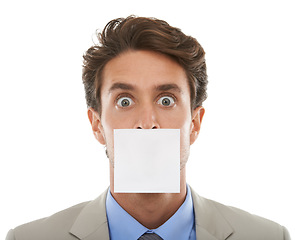 Image showing Business, man and sticky note on mouth in studio with surprise, shocked or wow for secret or announcement. Entrepreneur, paper and person or face with censored, silence and victim in white background