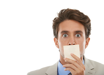 Image showing Business, man and sticky note on face in studio with surprise, shocked or wow for secret or mockup space. Entrepreneur, paper and person or mouth with censored, silence and victim in white background