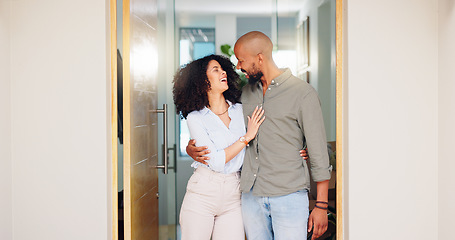Image showing Home, hug and couple with doorway, funny and marriage with relationship, bonding and romance. Apartment, people and man with woman, embrace or happiness with humor, smile and laughing with date