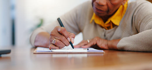 Image showing Senior woman, hands and writing agreement on contract, form or application for retirement plan or insurance at home. Closeup of elderly female person signing documents or paperwork on table at house