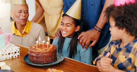 Image showing Happy family, birthday and cake in celebration for party, holiday or special day together at home. Excited little girl or child smile in growth, love or care for event, bonding and wish with candles