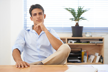 Image showing Businessman, relax or portrait with confidence at desk with pride for career ambition or mindset. Thinking, serious manager or male employee with hand on chin at workplace, office or table for job