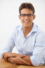 Image showing Man, portrait and glasses for vision with eye care, happy with optometry and professional style on white background. Smile on face for eyesight with fashion frame and prescription lens in studio