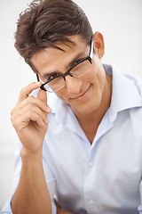 Image showing Man, glasses for vision with eye care and optometry, face with professional style isolated on white background. Smart, nerd and smile in portrait with fashion frame and prescription lens in studio