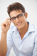 Image showing Happy man, face and glasses choice for vision with eye care, optometry and professional style on white background. Smile in portrait for eyesight with fashion frame and prescription lens in studio