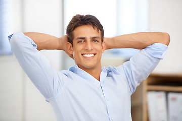 Image showing Portrait, relax or happy man in workplace on break for mental health, pride or wellness at desk. Calm, freedom or male employee with smile or hand behind his head in a business stretching or resting