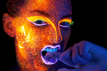 Image showing Art, woman with neon face paint and beauty, portrait with bright lipstick and creative skincare on dark background. Orange glow, disco aesthetic and model in studio for creativity with makeup