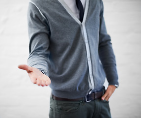 Image showing Person, hand and businessman in fashion, offering and ready for handshake, professional and employee. Product placement, marketing geek and choice for agreement, manager and onboarding workers