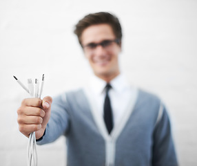 Image showing Man, cables and businessman in fashion, smiling and happy for connection, professional and employee..Technician, technical geek and electrician as manager and stylish man in corporate outfit