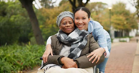 Image showing Nurse, hug and park with old woman in a wheelchair for retirement, elderly care and physical therapy. Trust, medical and healthcare with portrait of patient and caregiver in nature for rehabilitation