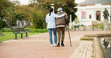 Image showing Nurse, relax and park with old woman and walking stick for retirement, elderly care and physical therapy. Trust, medical and healthcare with senior patient and caregiver in nature for rehabilitation