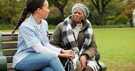 Image showing Nurse, happy and relax with old woman on park bench for retirement, elderly care and conversation. Trust, medical and healthcare with senior patient and caregiver in nature for nursing rehabilitation