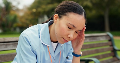 Image showing Headache, tired and nurse with woman on park bench for thinking, fatigue and burnout. Mental health, anxiety and stress with female person in nature for frustrated, exhausted and healthcare problem