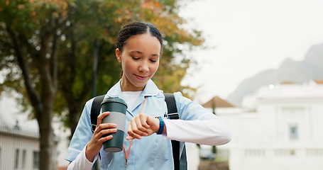 Image showing Nurse woman, watch and time outdoor for thinking, vision or ideas for healthcare career in Cape Town. Young doctor, park and nature for walk, coffee cup and mindset on path, wellness or late for work