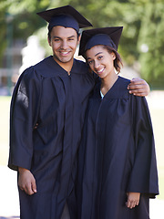 Image showing Happy couple, portrait and hug for outdoor graduation, qualification or career ambition in education. Man and woman student or graduate smile for higher certificate, diploma or degree in nature