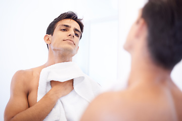 Image showing Man, hygiene and towel after washing face in mirror, cleaning and skincare or beauty. Male person, bathroom and wellness in morning routine, reflection and grooming or self care and basin at home