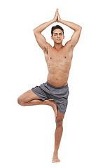 Image showing Man, meditation and tree pose or yoga in studio, spiritual awareness and prayer hands. Male person, pilates and peace or wellness and healing or relaxing, fitness and balance by white background